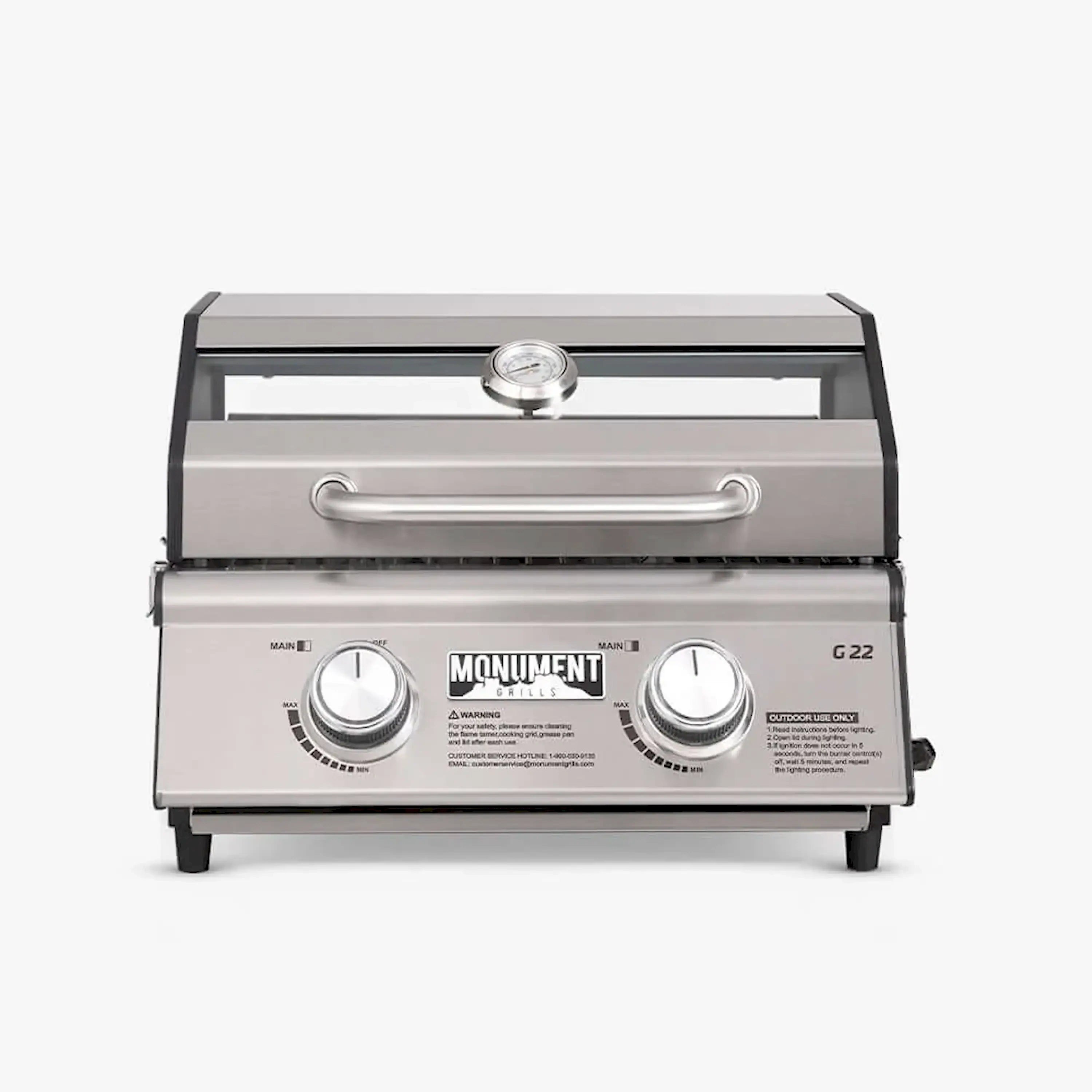 Closed-lid Monument G22 tabletop propane grill with handle and two front control knobs