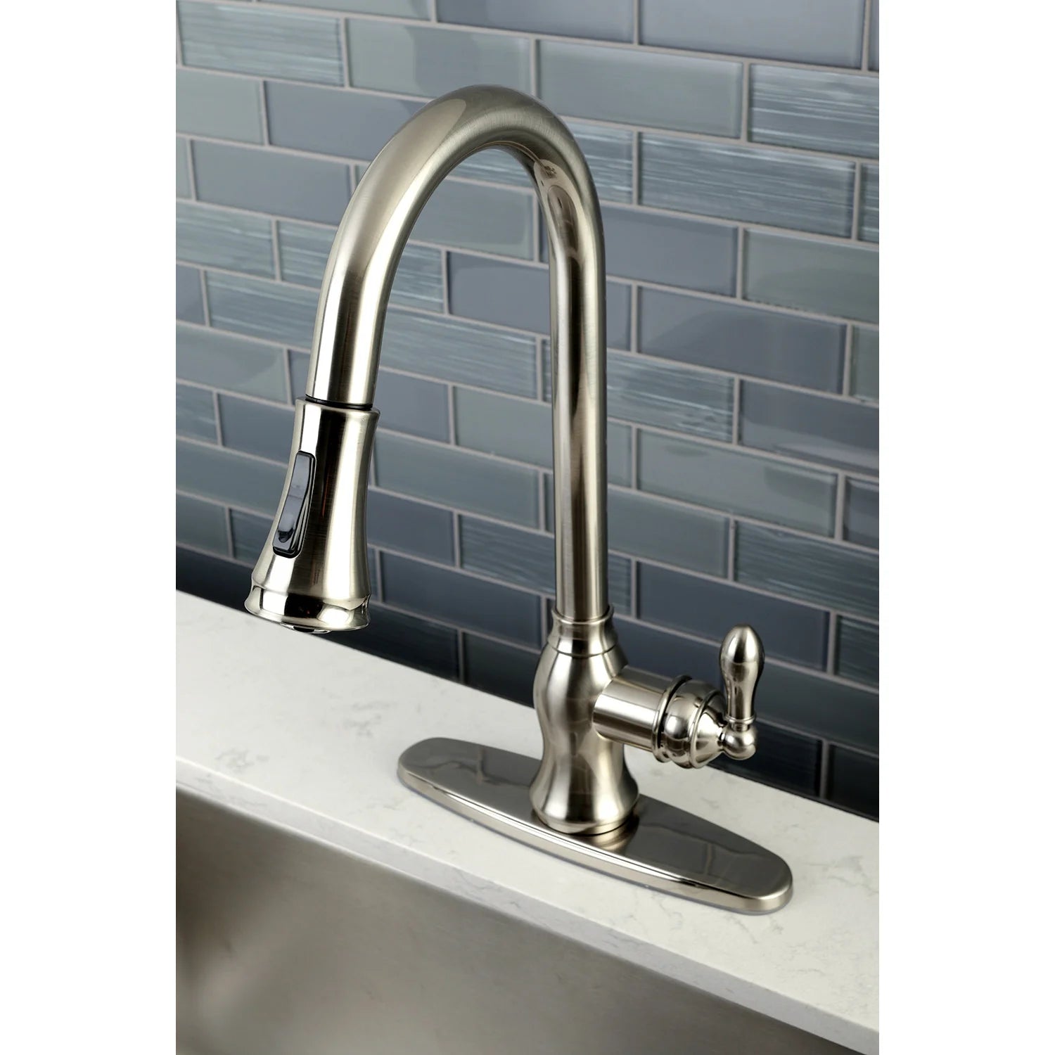 Brushed nickel arched kitchen faucet with pull-down sprayer and flat base plate
