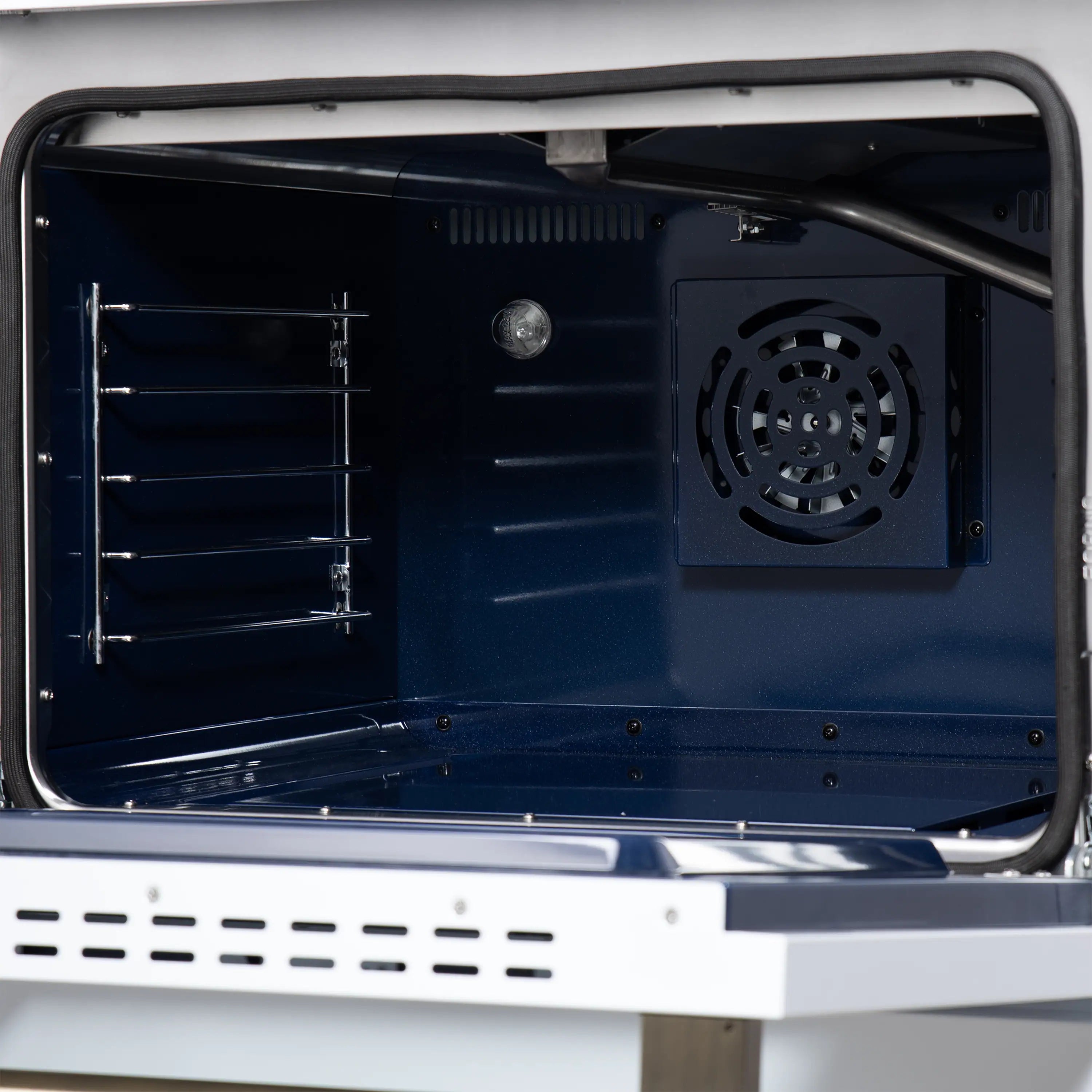 Open convection oven door showing dark interior racks and circular fan vent.