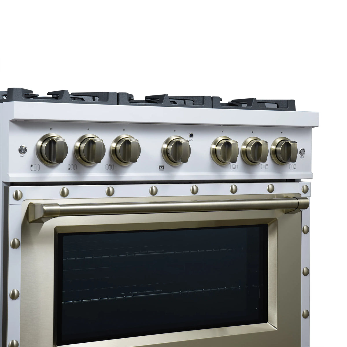 White gas range control panel with brass knobs and oven window with trim