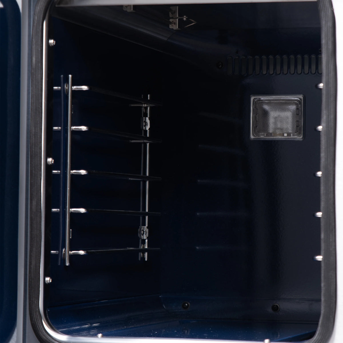 Oven door interior with wire racks and rectangular light cover