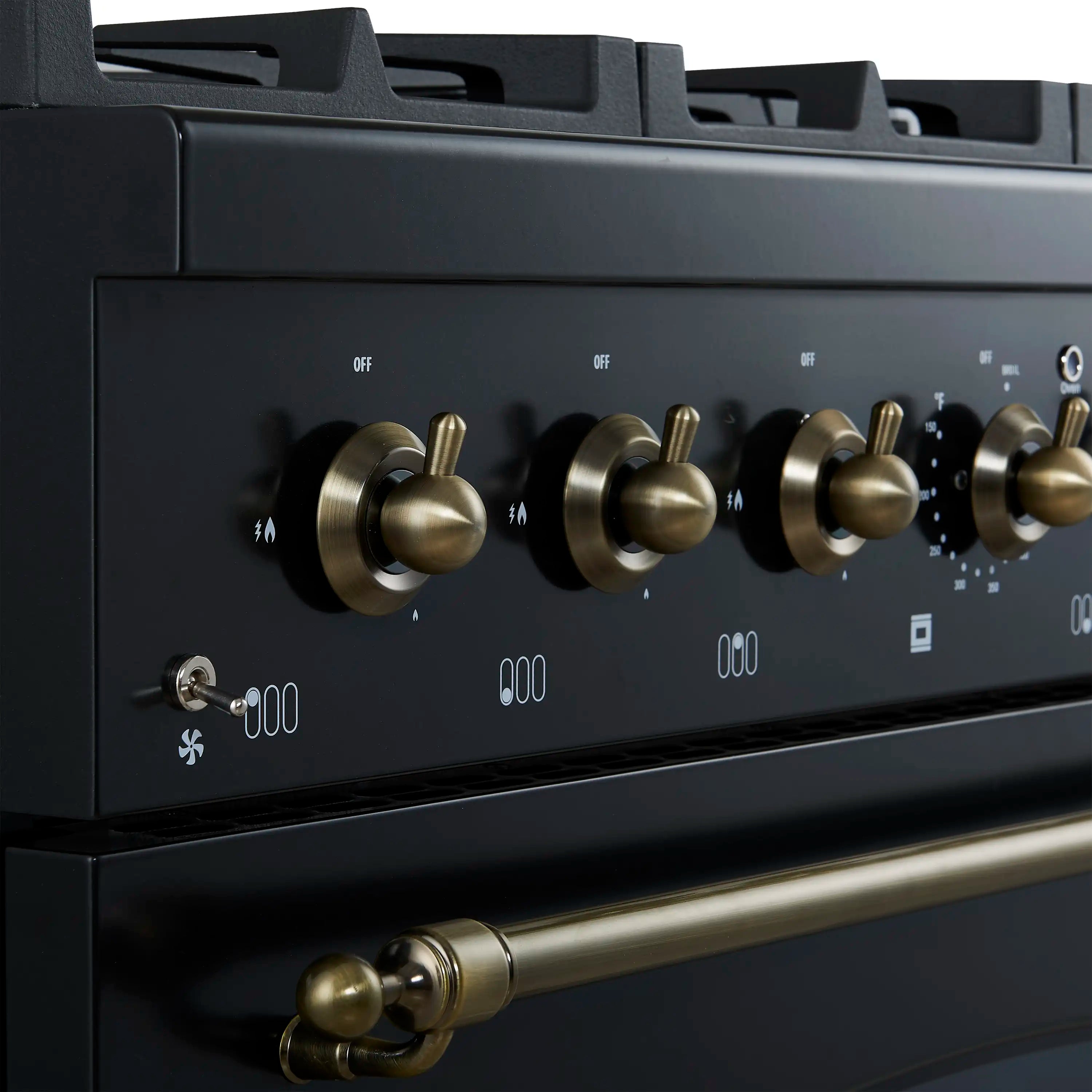 Gas range control panel with antique brass knobs and front burner indicator icons