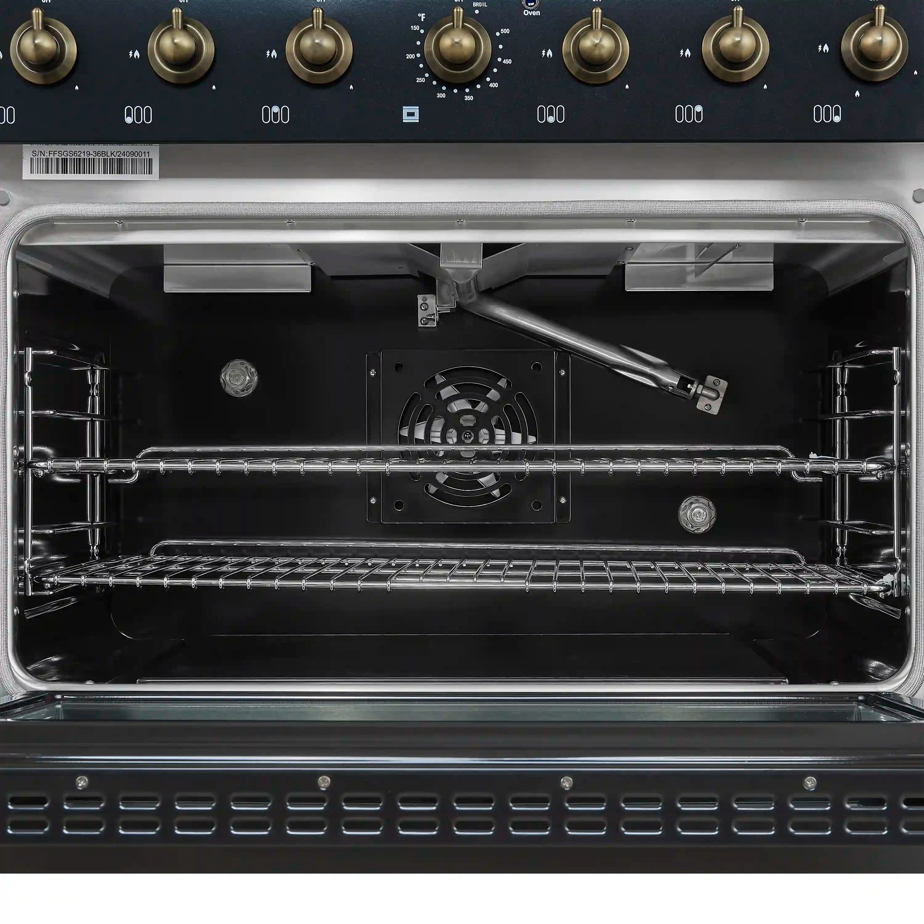 Open gas oven showing interior racks and burner housing in a black range
