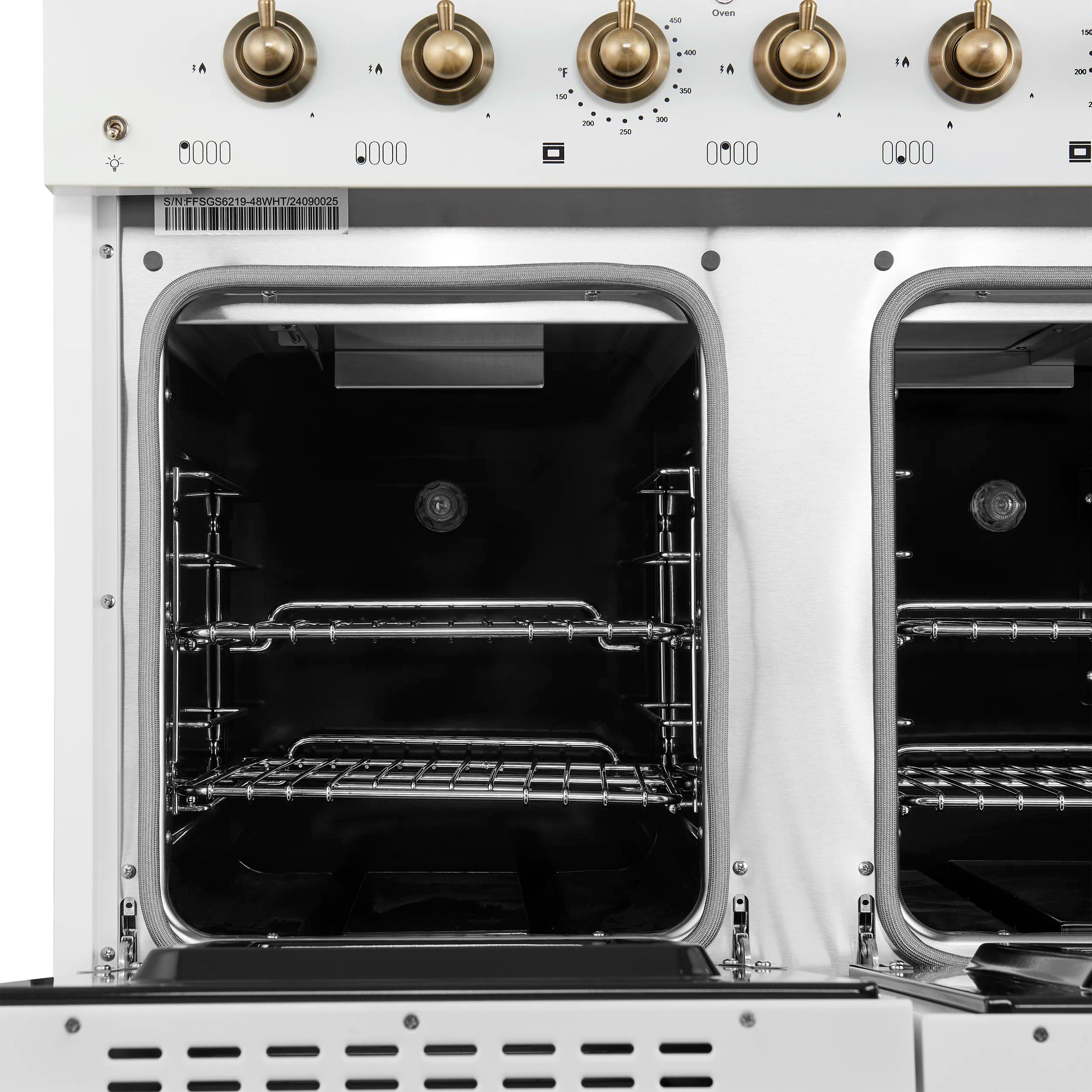 Two open oven doors showing black interiors and wire racks on a white range