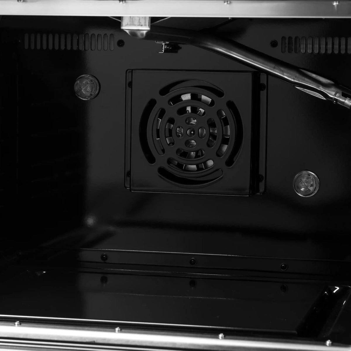 Oven back panel with circular fan vent and surrounding mounting screws