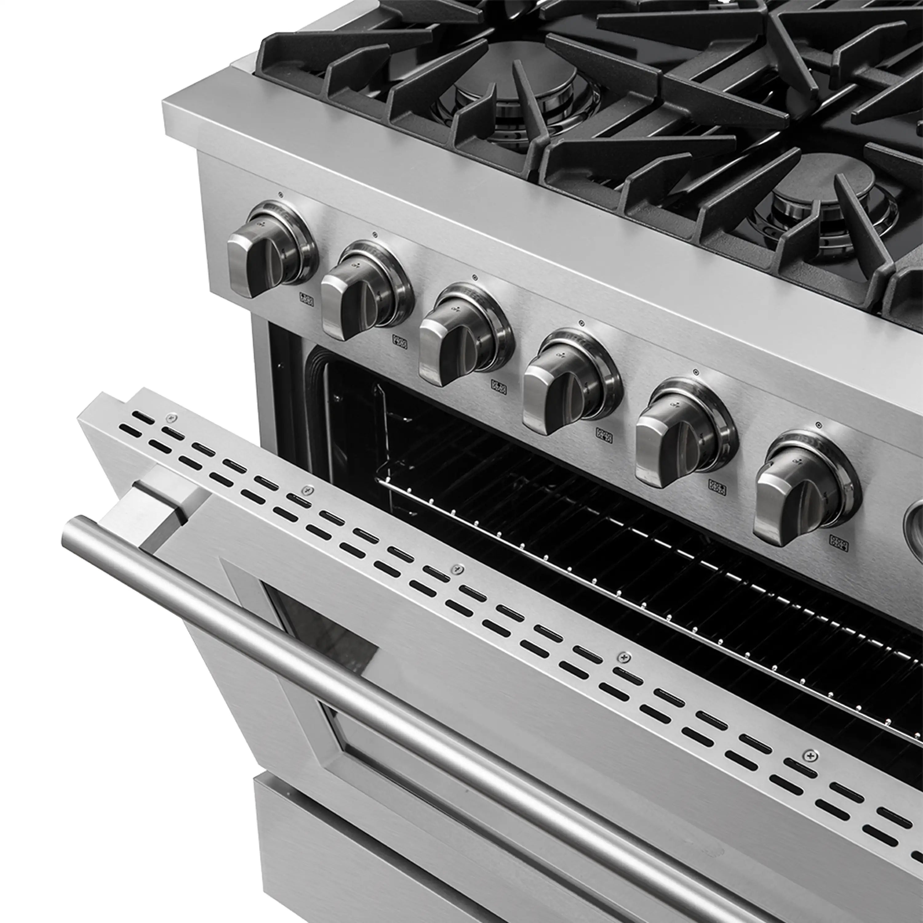 Close-up of stainless steel gas range control knobs and grates above oven cavity