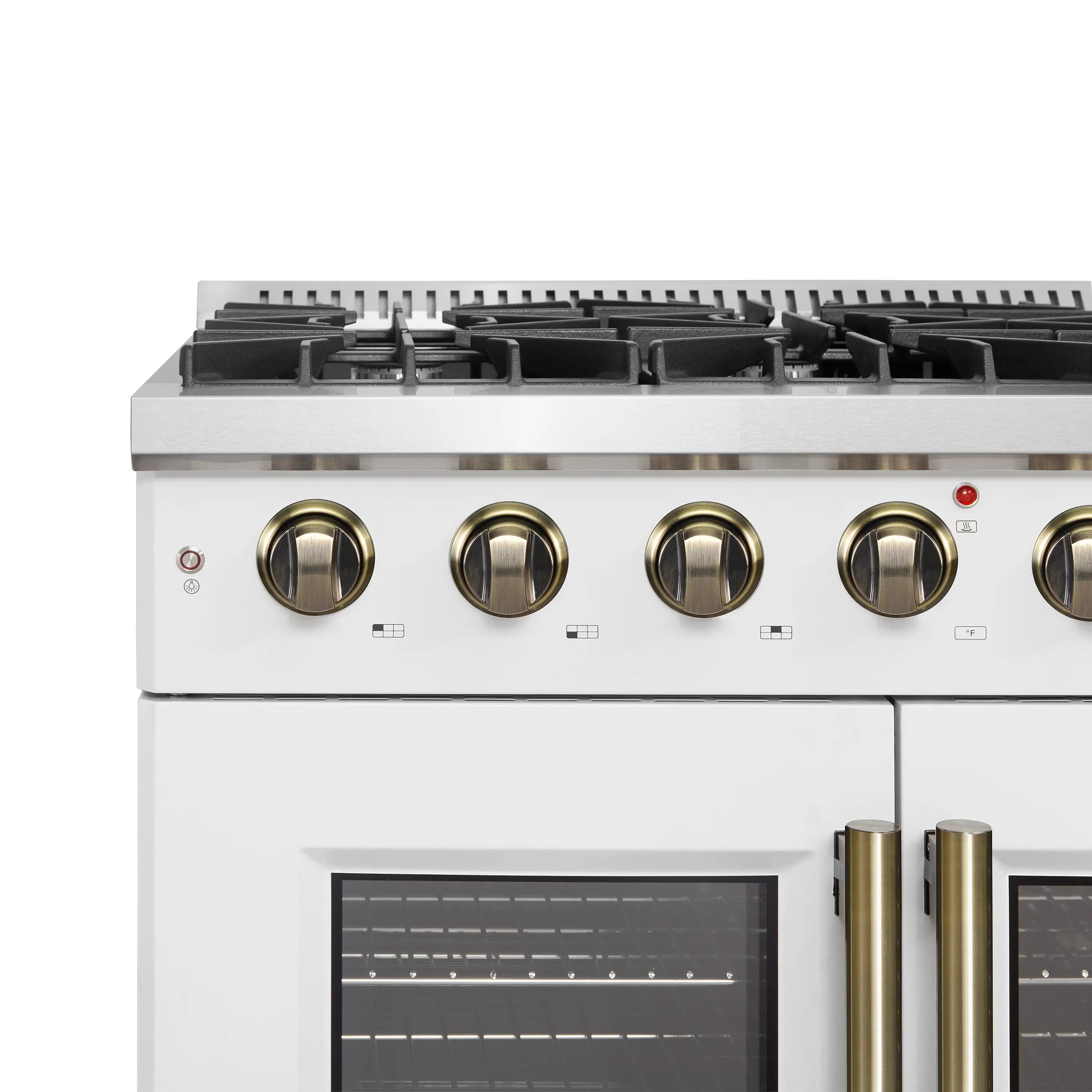 White gas range control panel with brass knobs and black cooktop burners.