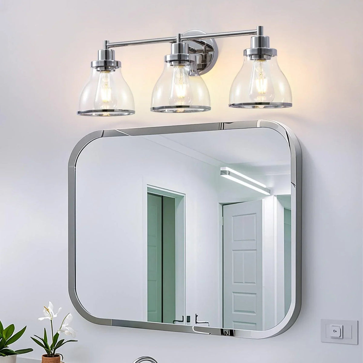 Modern 3-light bathroom vanity light with chrome frame and clear glass shades