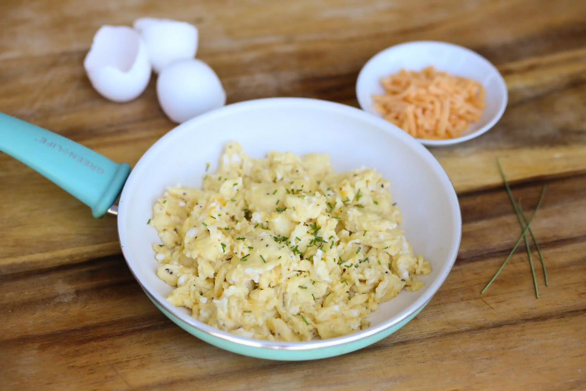 Freeze-dried side dish in a bowl with shredded herb seasoning and a plastic spoon