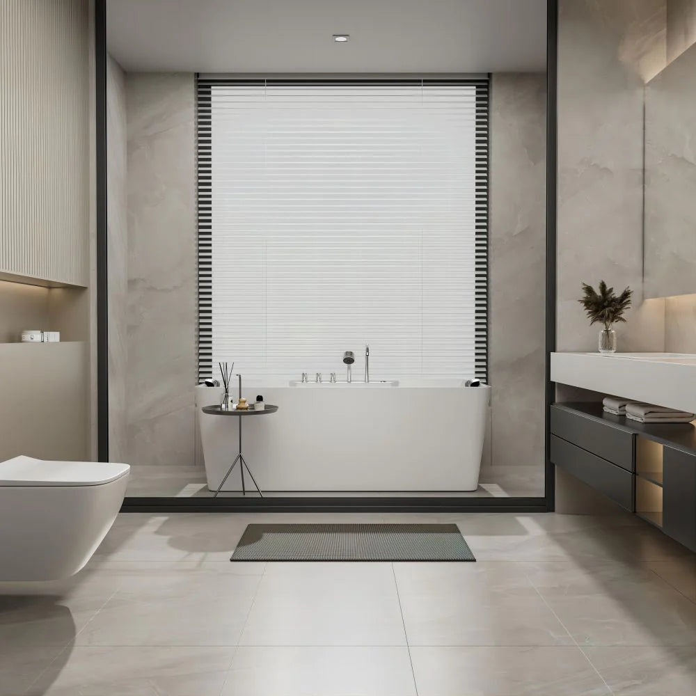 White freestanding bathtub with chrome faucet and centered drain cover, rear view.