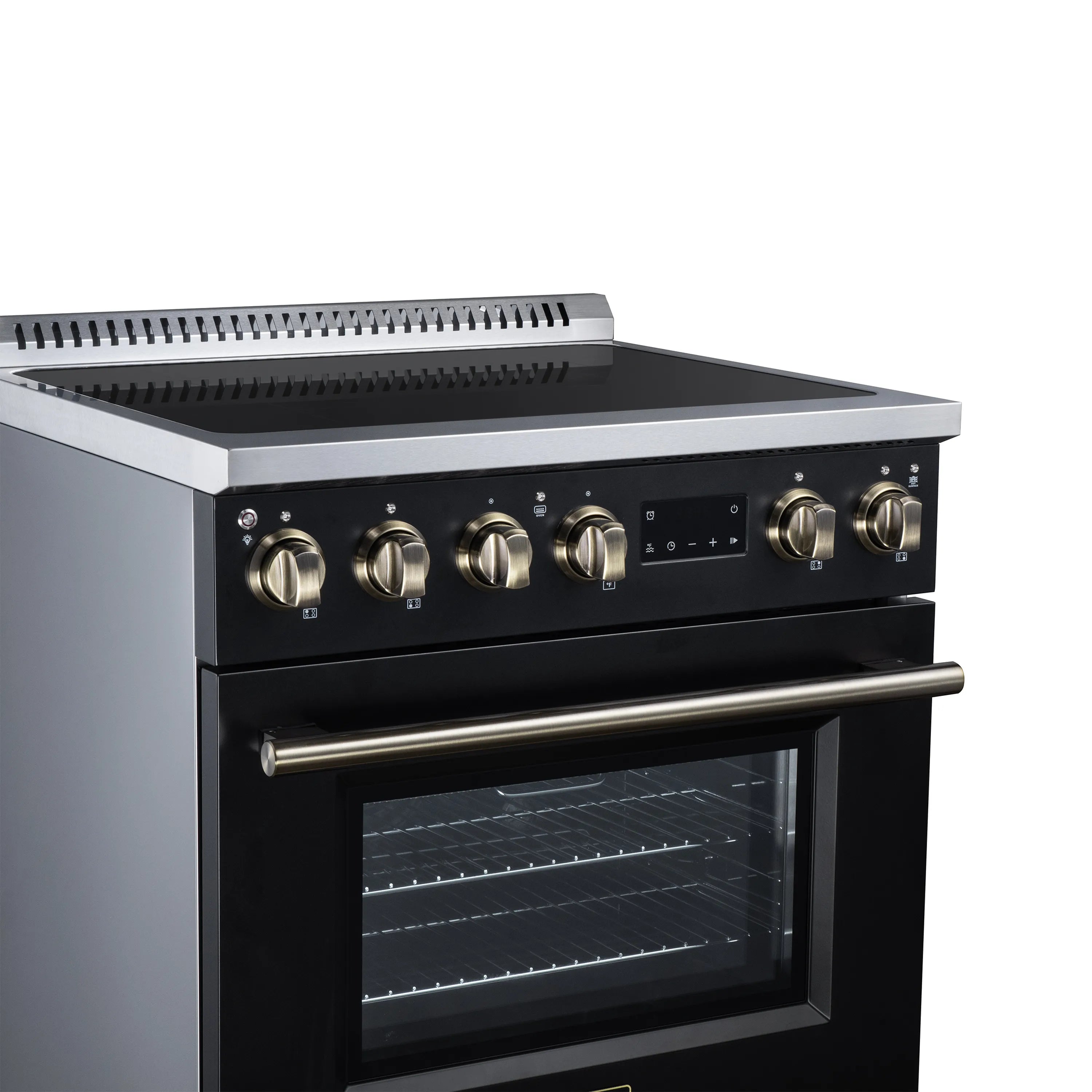 Black induction range cooktop with brass knobs and oven window below