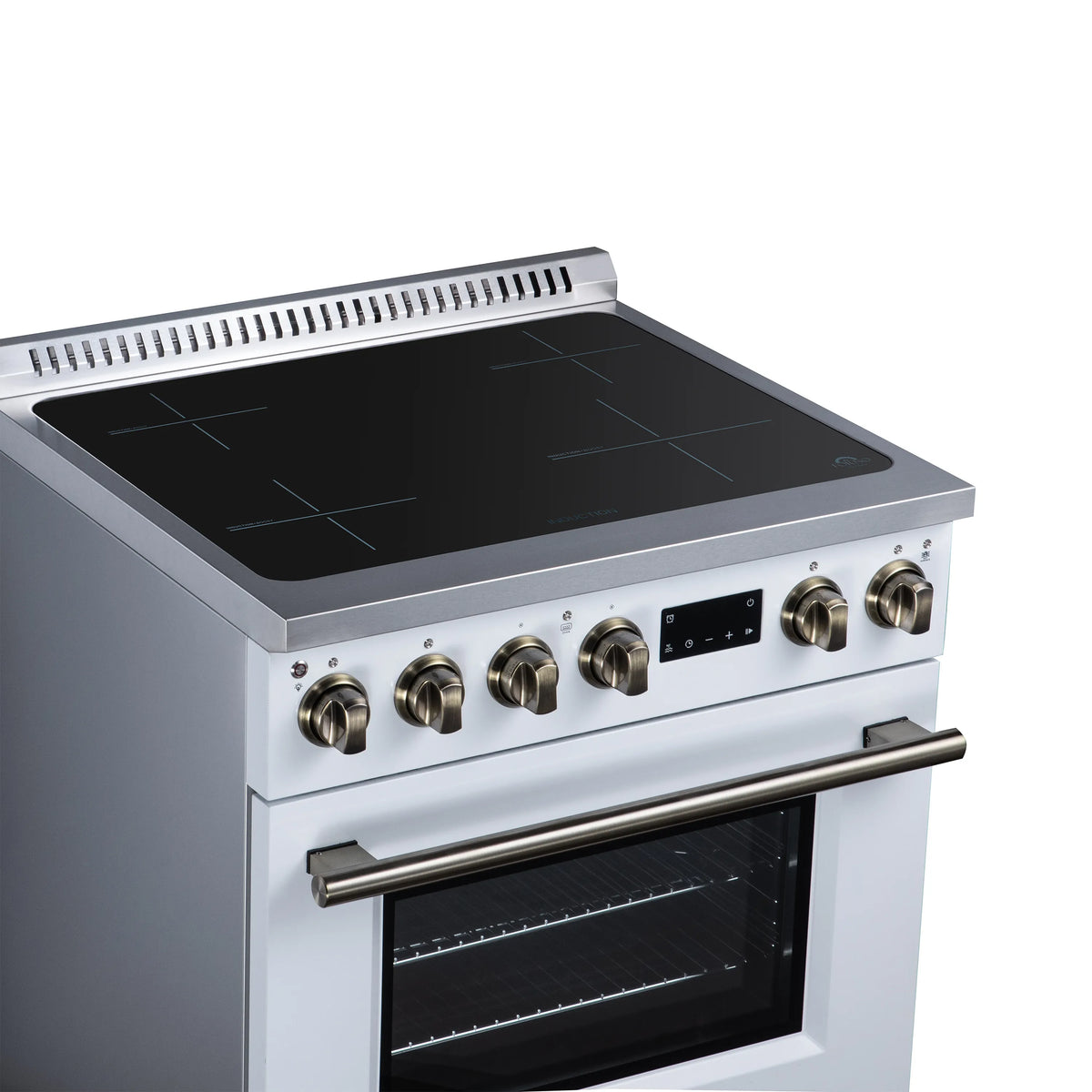 White induction cooktop and oven, black glass cooking surface with brass control knobs