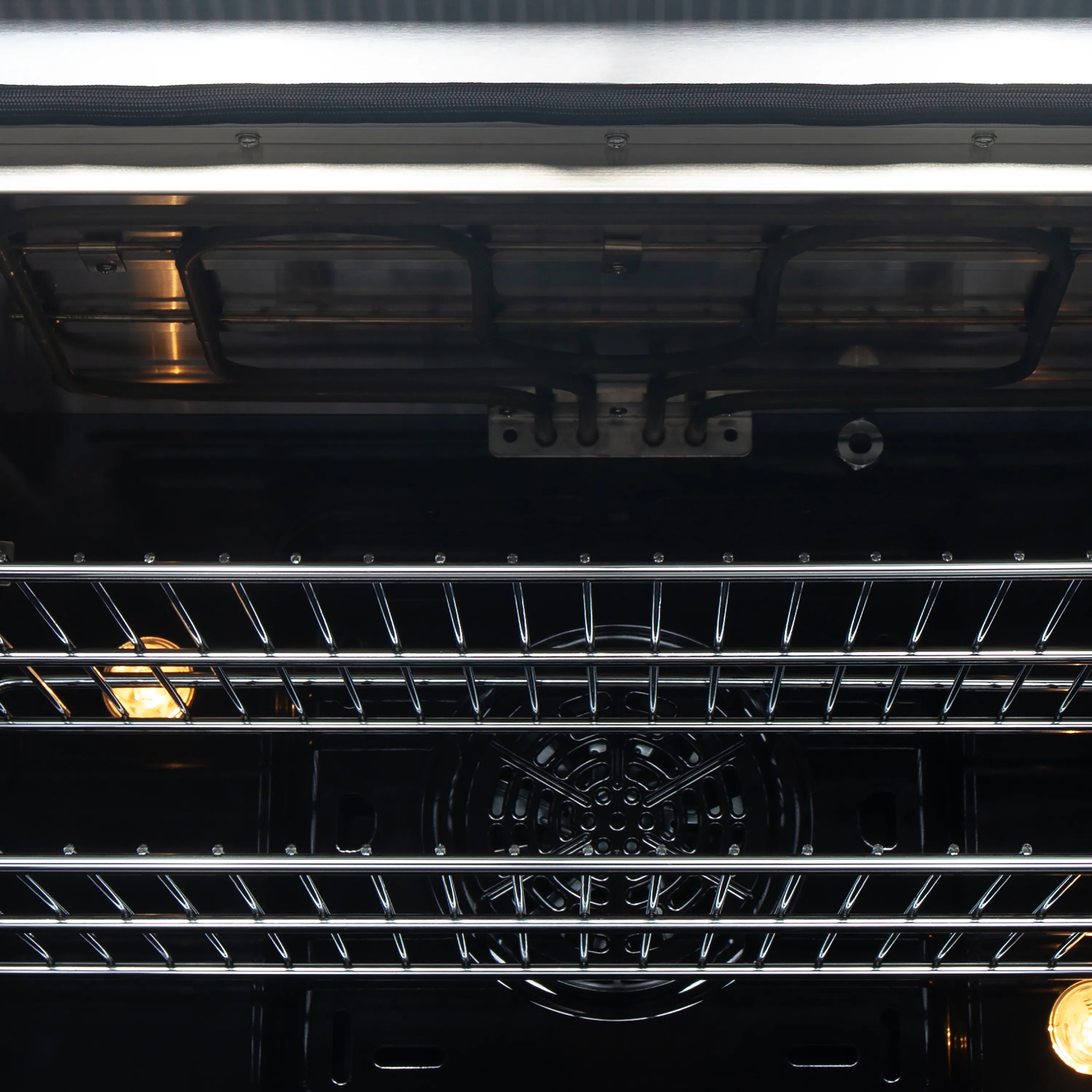 Oven interior with racks and glowing heating elements