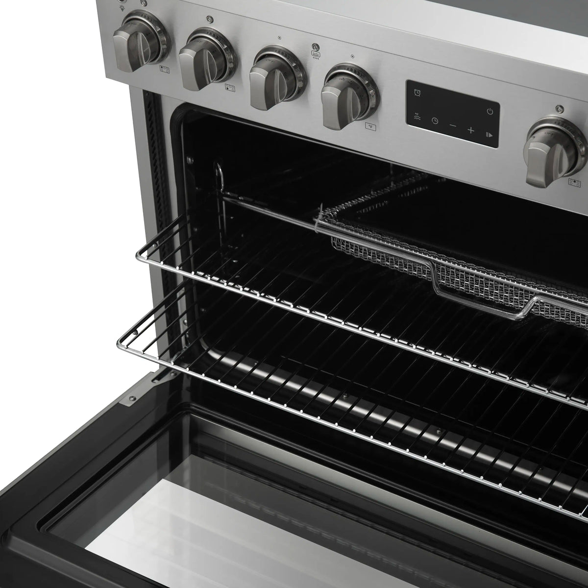 Oven interior of a stainless steel induction range with wire rack and broiler element