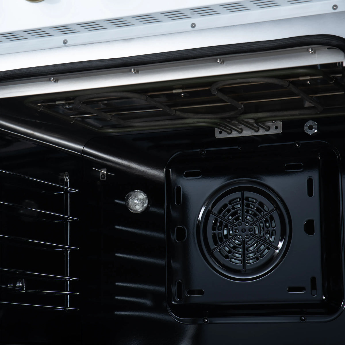 White oven cavity with fan intake and removable rear panel
