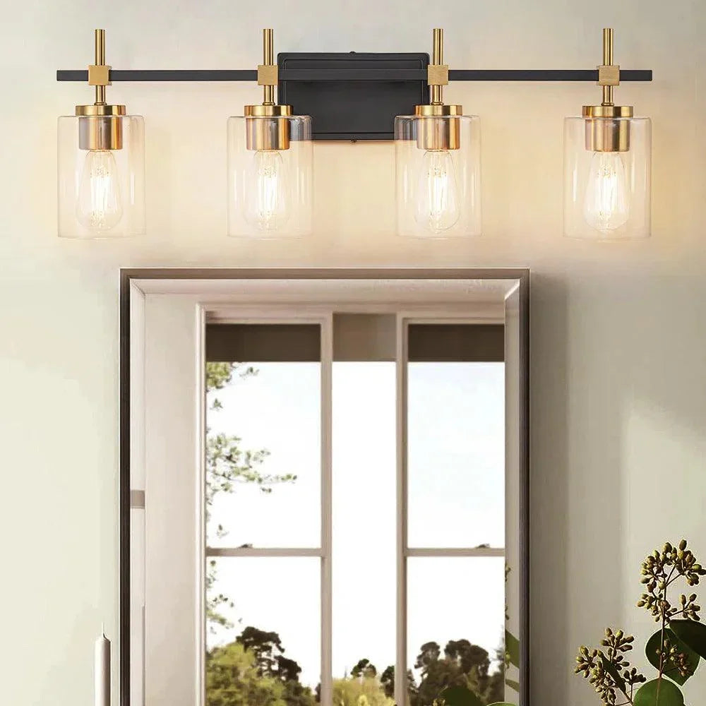 Four-light vanity light above a mirror: black metal frame with clear glass shades