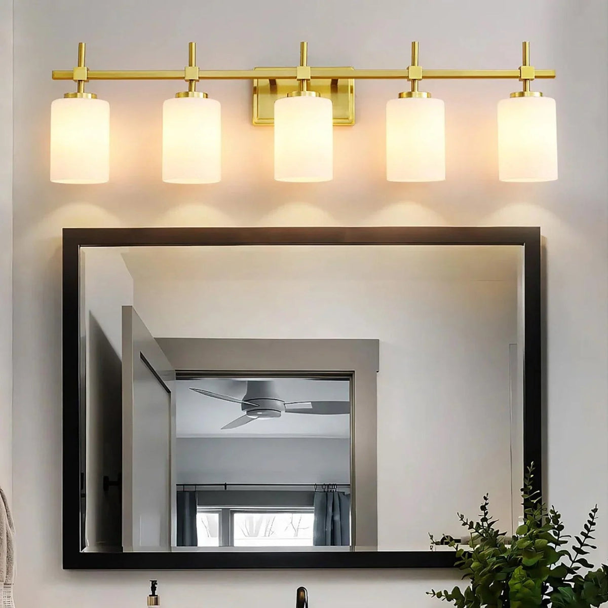 5-light bathroom linear vanity light with frosted glass shades in golden finish