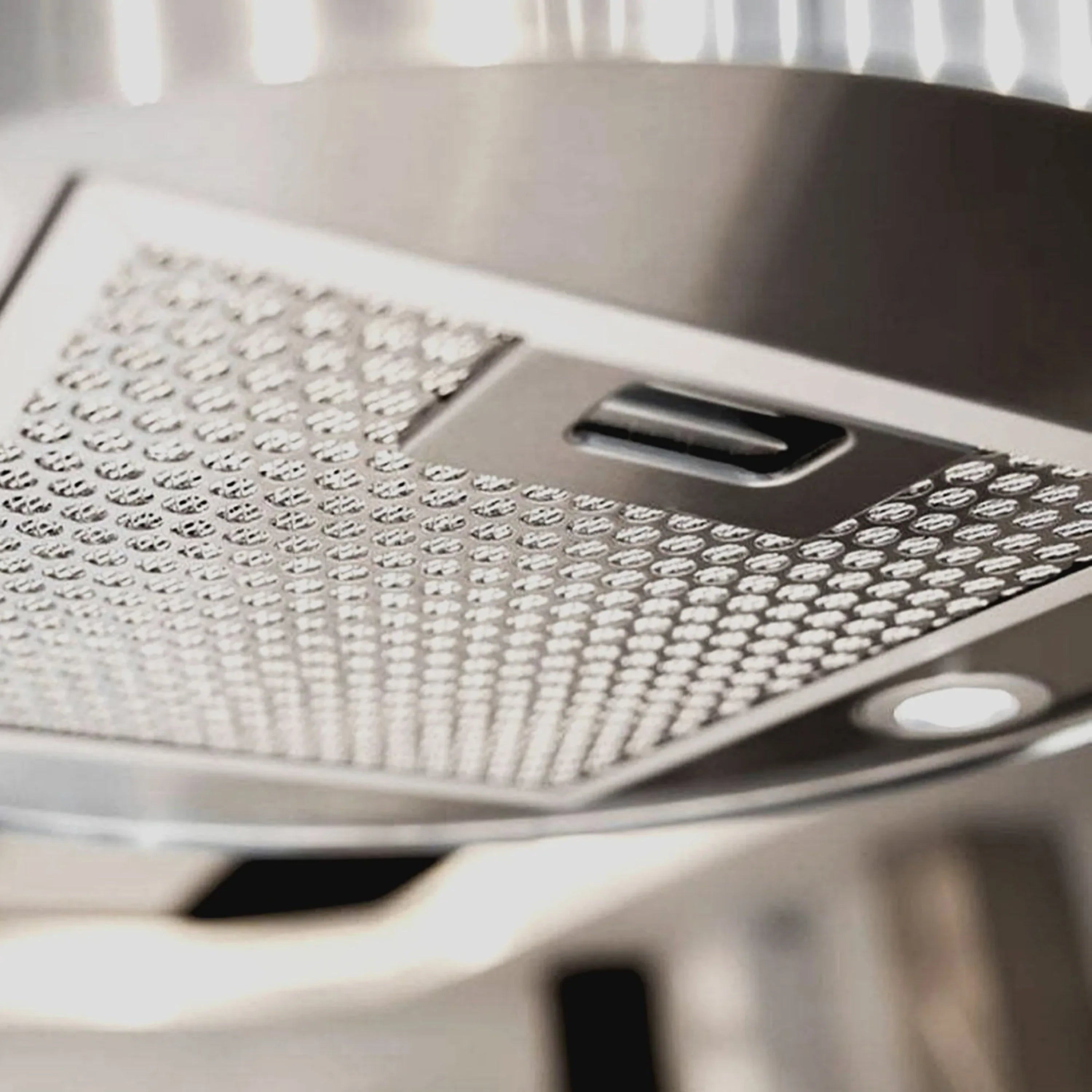 Stainless steel range hood vent with perforated grease filter panel