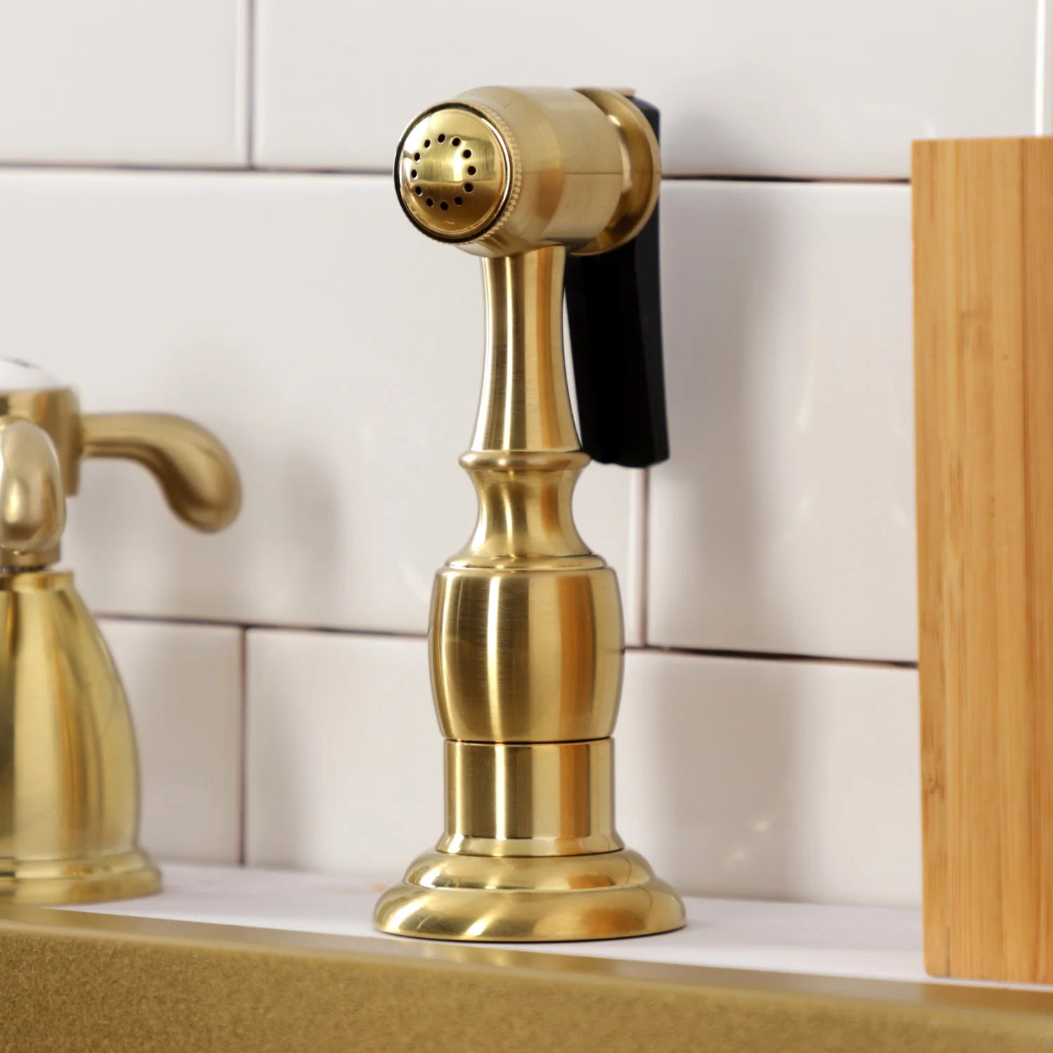 Brushed brass pull-down kitchen sprayer head with spray holes