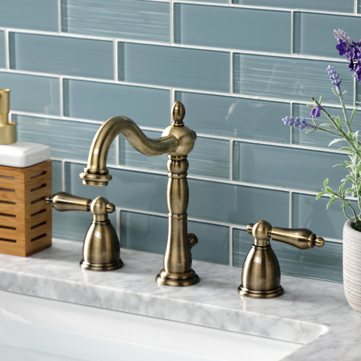 Heritage Widespread Bathroom Faucet with Brass Pop-Up in Antique Brass