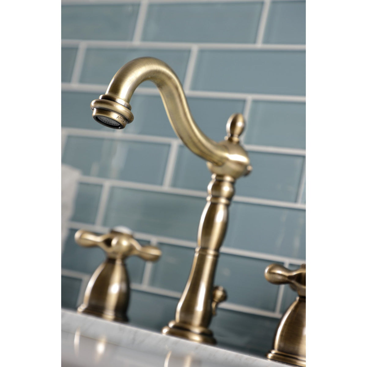 Heritage Widespread Bathroom Faucet with Brass Pop-Up in Antique Brass