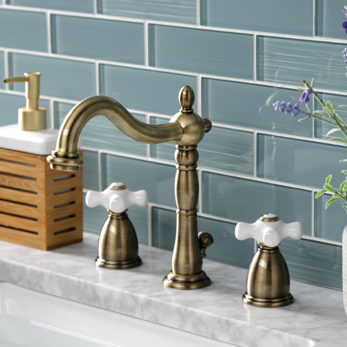 Heritage Widespread Bathroom Faucet with Brass Pop-Up in Antique Brass