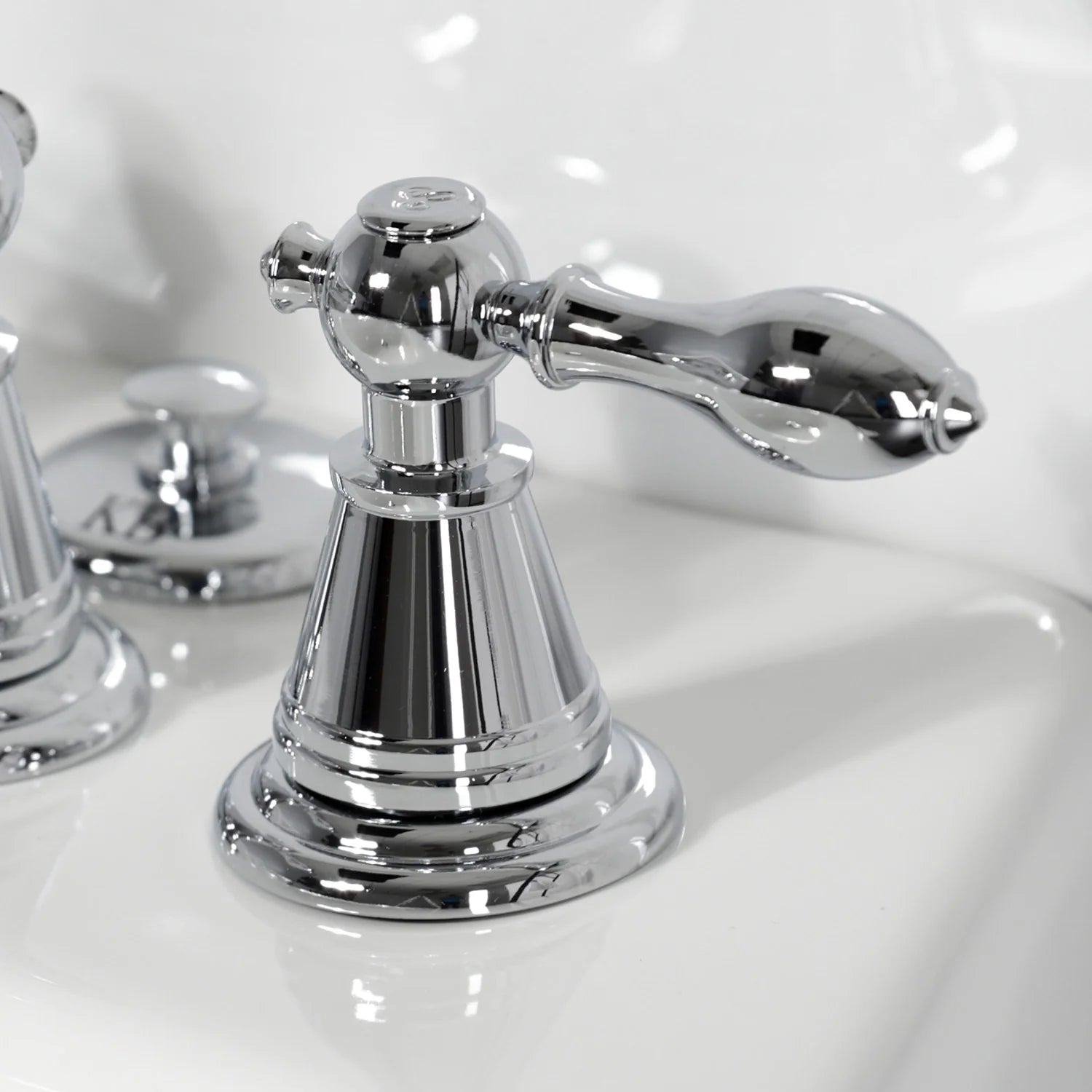 Polished chrome bidet faucet spout and left handle with decorative base