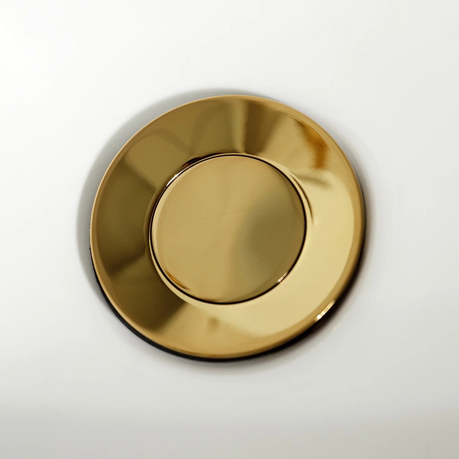 Round polished brass escutcheon plate for the bidet faucet control