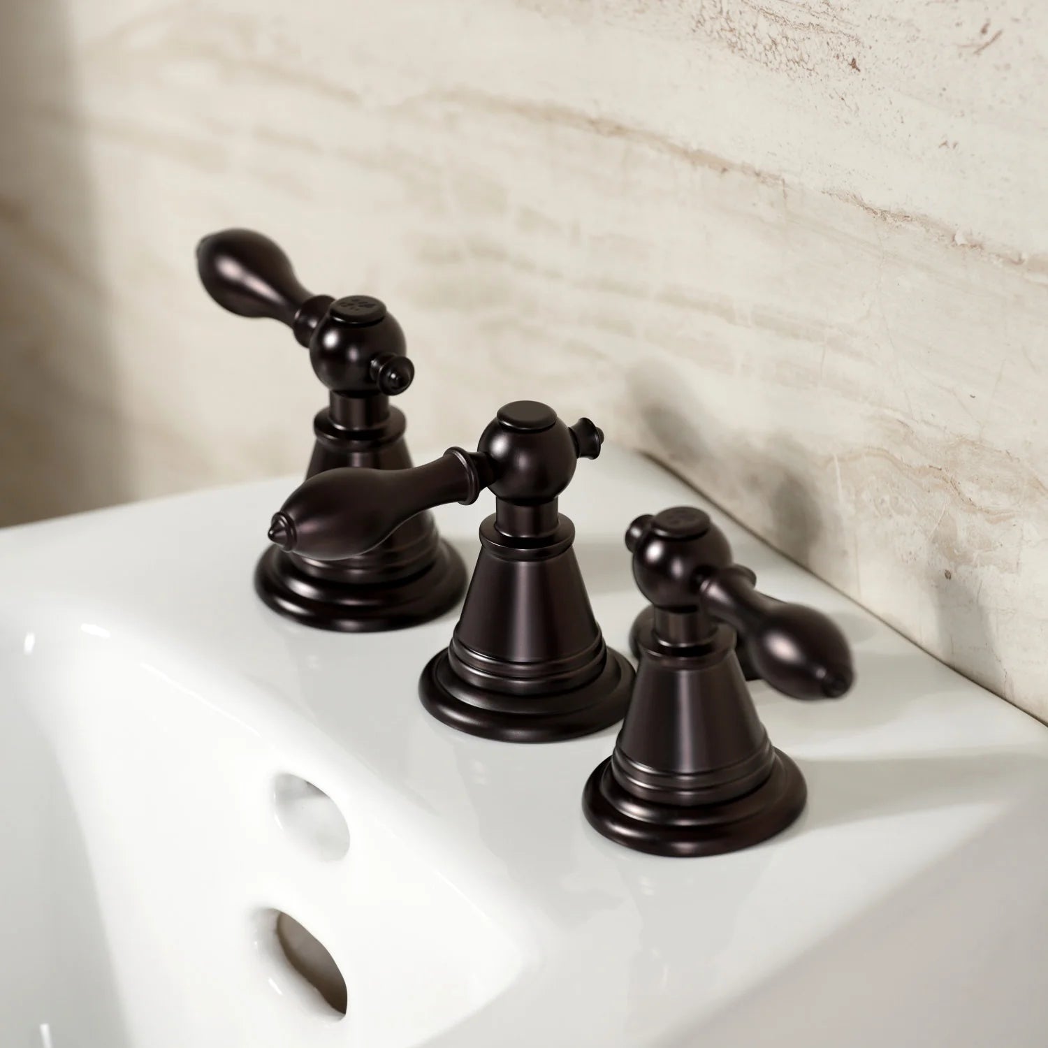 Oil-rubbed bronze three-handle bidet faucet viewed from front corner