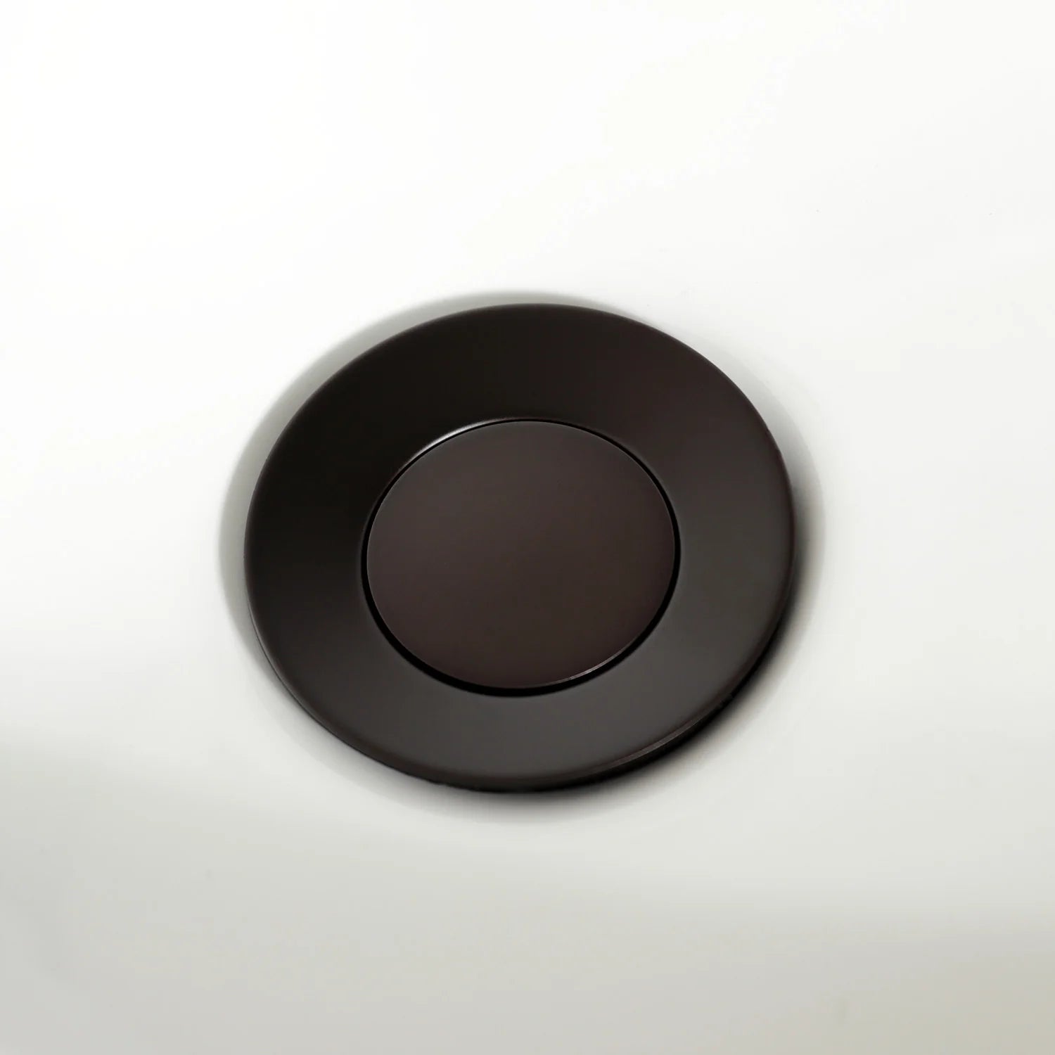 Oil-rubbed bronze circular bidet faucet trim plate with centered recessed circle