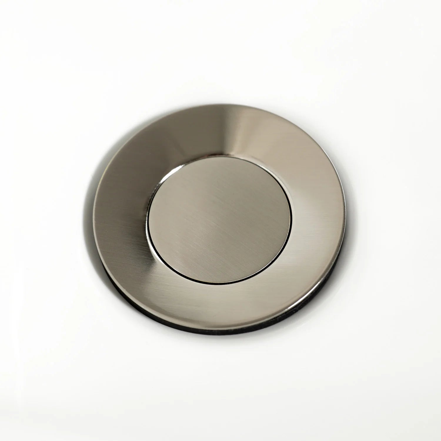 Brushed nickel bidet faucet escutcheon cover plate with round center.