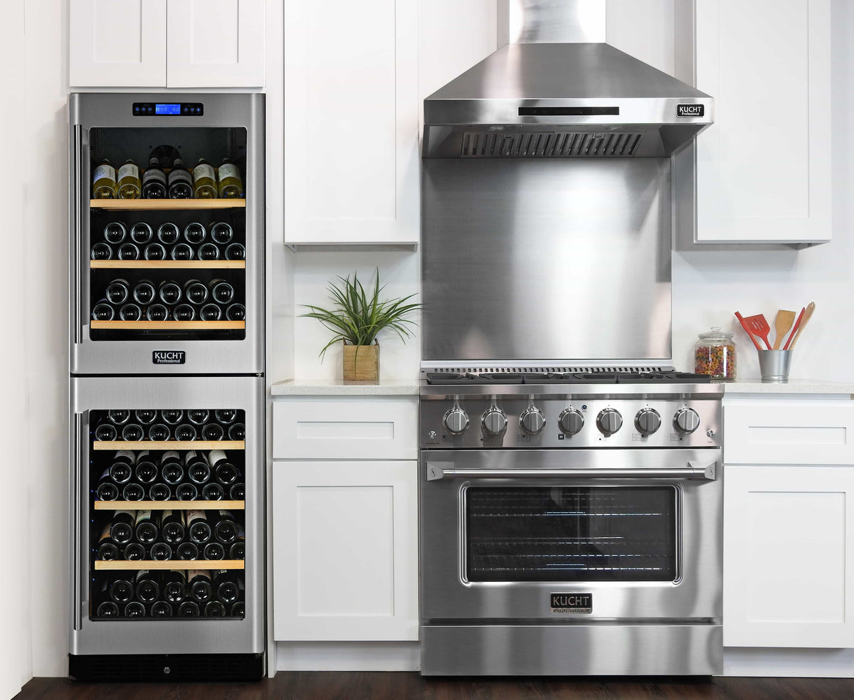 Stainless steel dual fuel range beside tall glass-door wine refrigerator and dishwasher