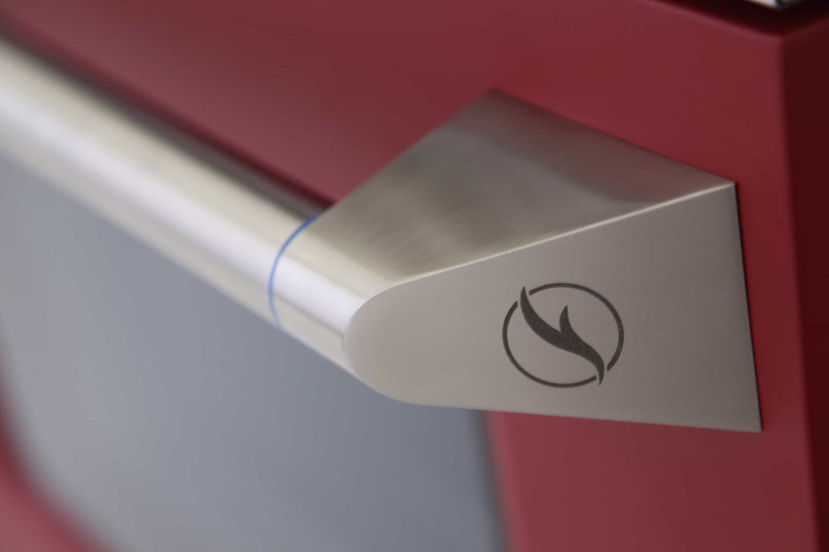 Stainless handle with flame icon on red Kucht range oven door