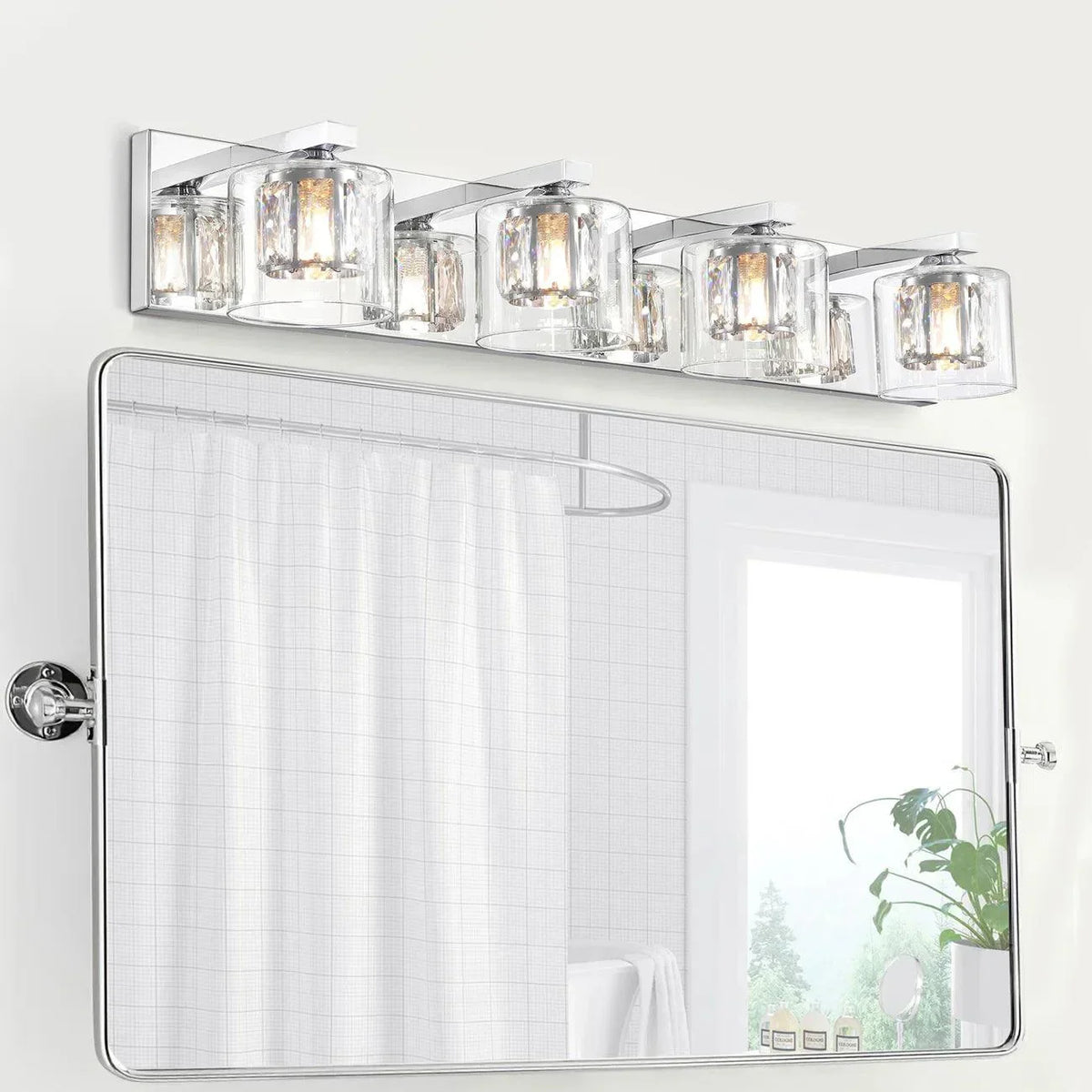 Chrome 4-light vanity light bar with clear glass shades mounted on the wall