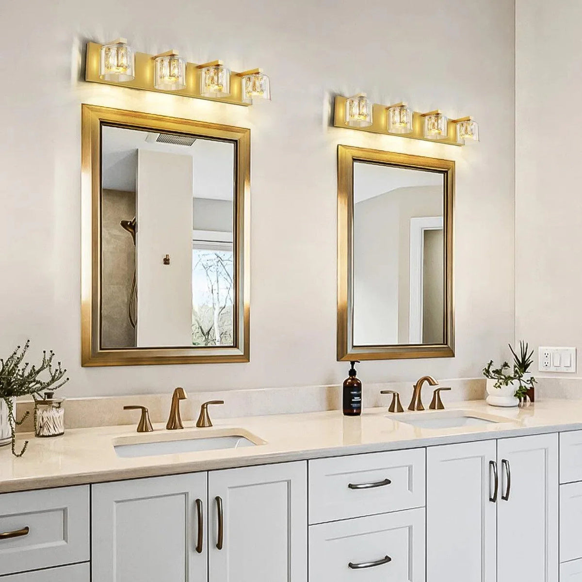 Brush gold 4-light vanity light over mirror with clear cylindrical glass shades