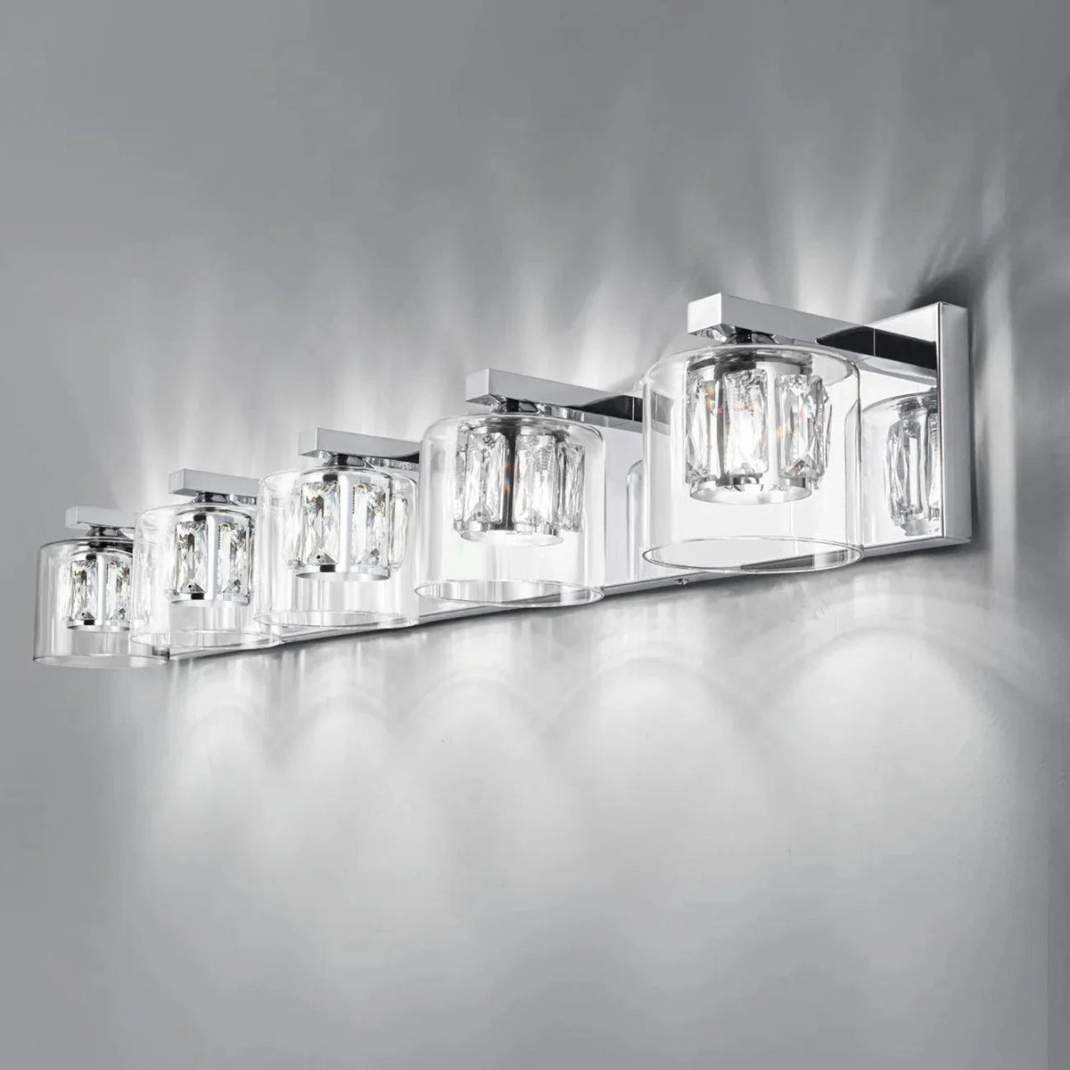 Chrome 5-light bathroom vanity light with multiple clear glass shades in a row.