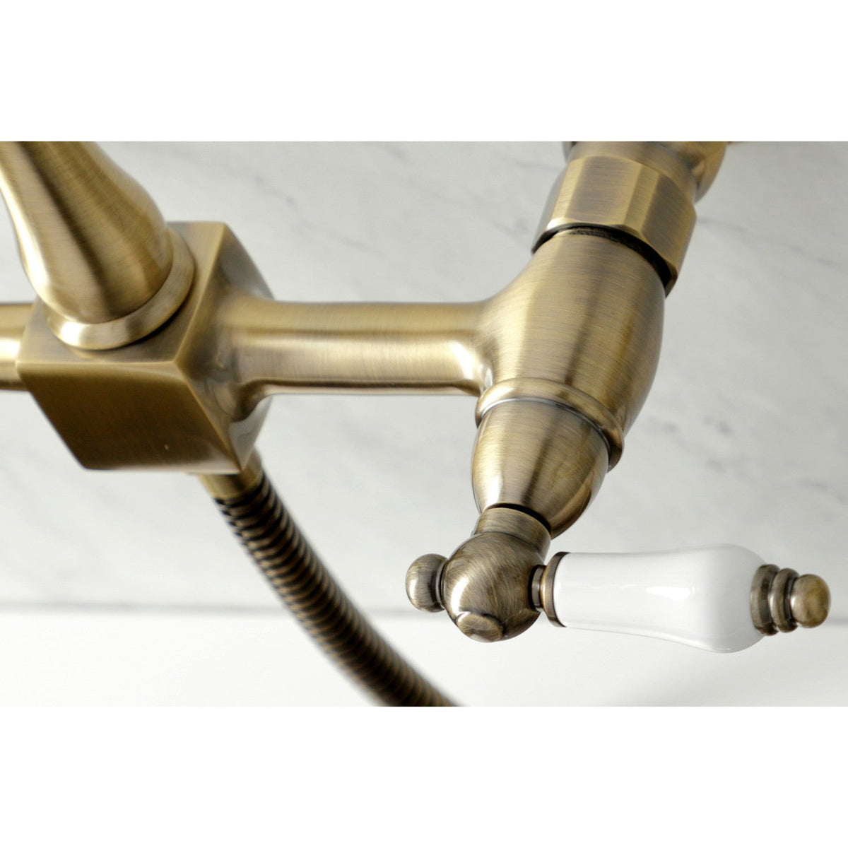 Heritage Double-Handle Wall-Mount Bridge Kitchen Faucet with Brass Sprayer in Antique Brass