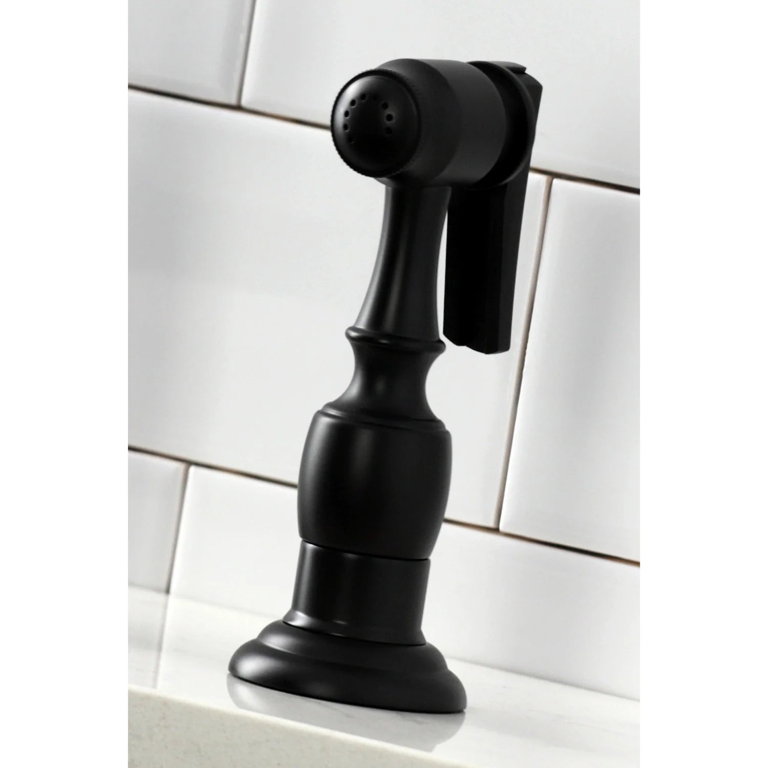 Matte black side sprayer head on bridge kitchen faucet