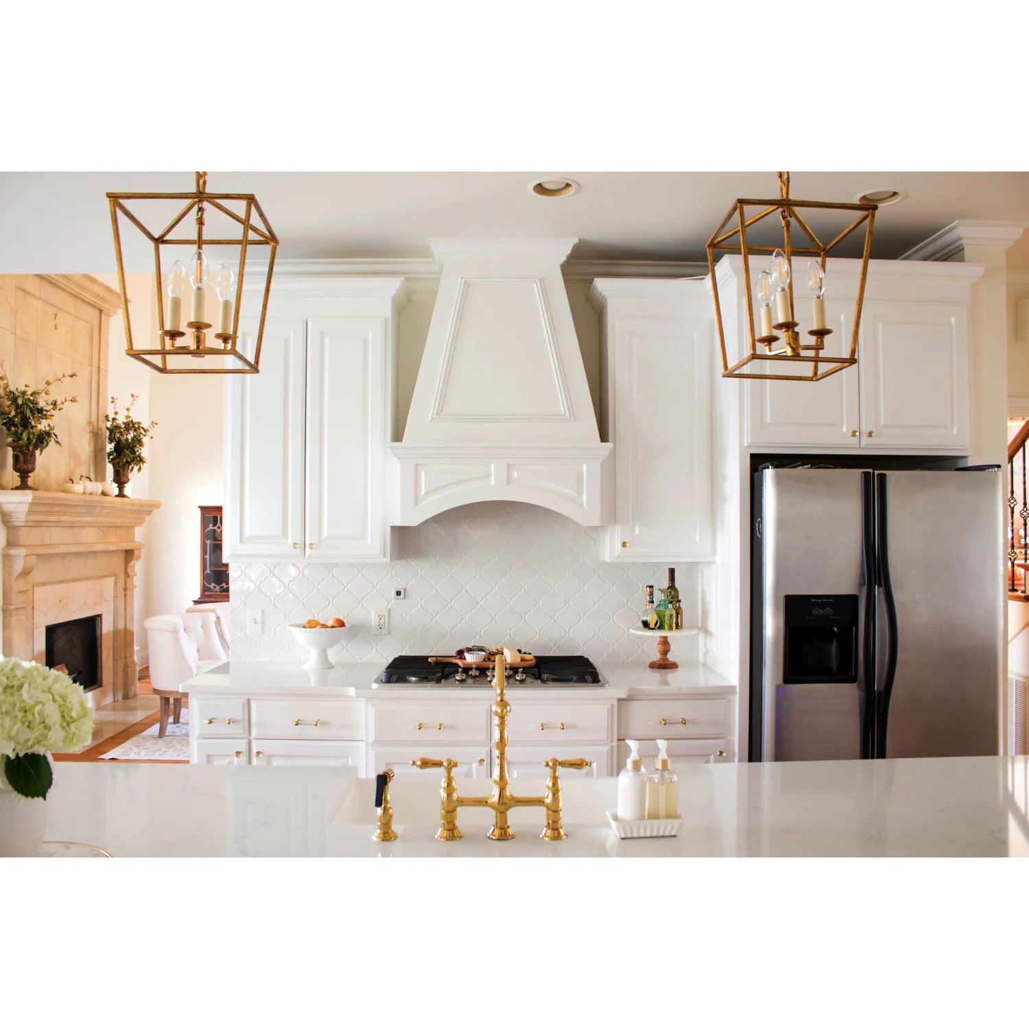 Polished brass bridge kitchen faucet with cross handles and gooseneck spout
