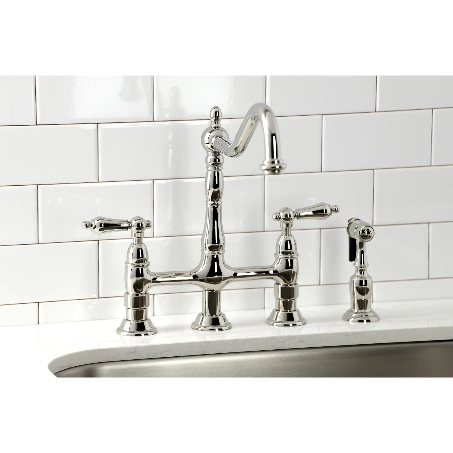 Polished nickel bridge kitchen faucet with two handles and side sprayer