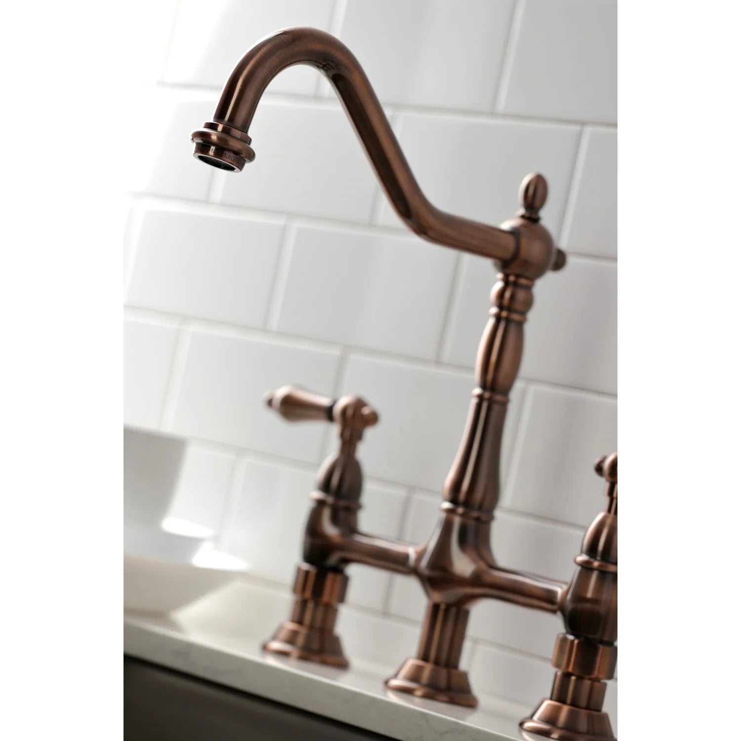 Antique copper arched spout bridge faucet with cross handles and countertop sprayer