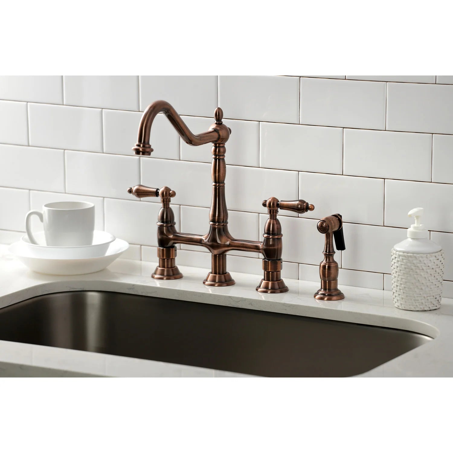 Antique copper bridge kitchen faucet with side sprayer and multiple knob handles