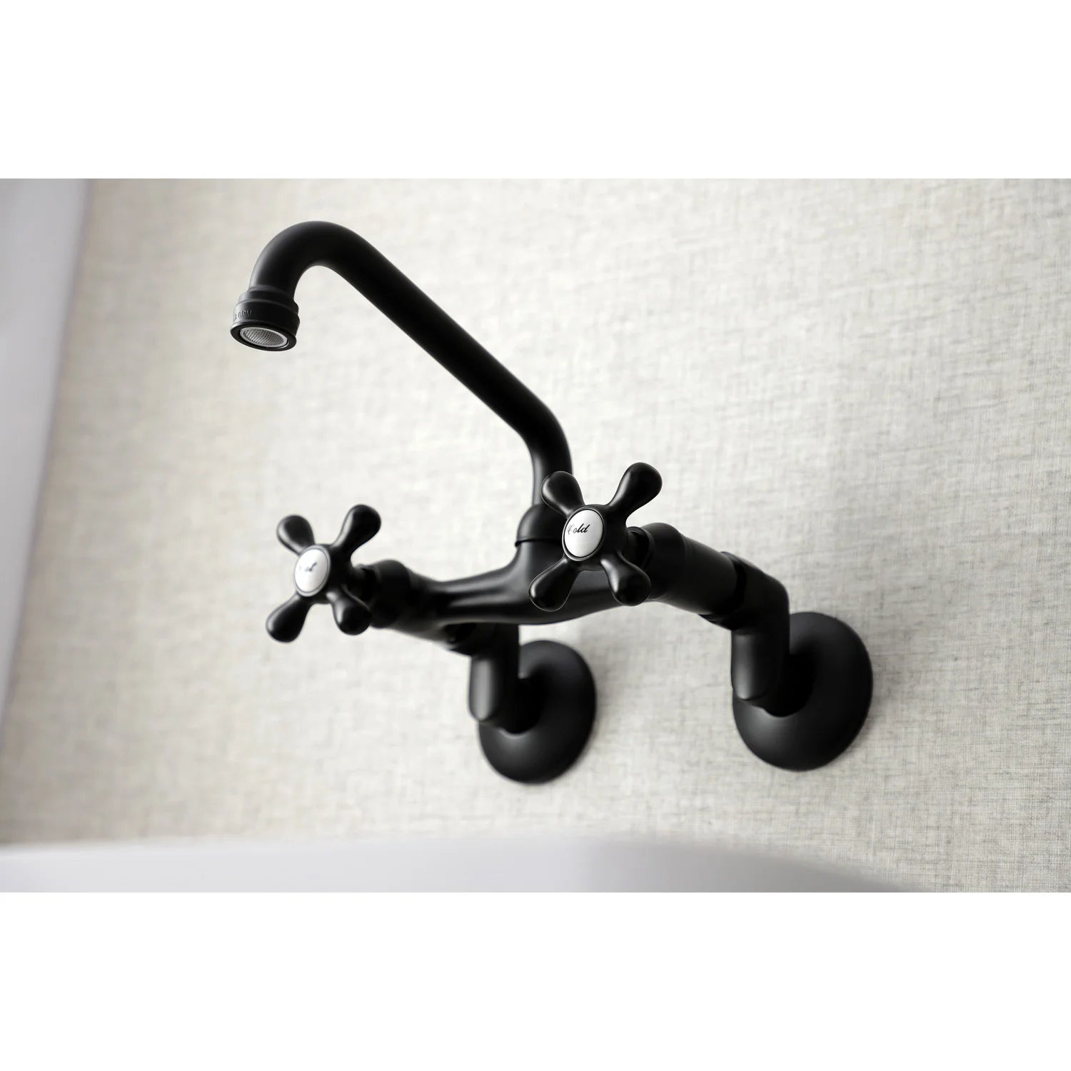 Matte black wall-mount kitchen faucet with arched spout and hot/cold cross handles