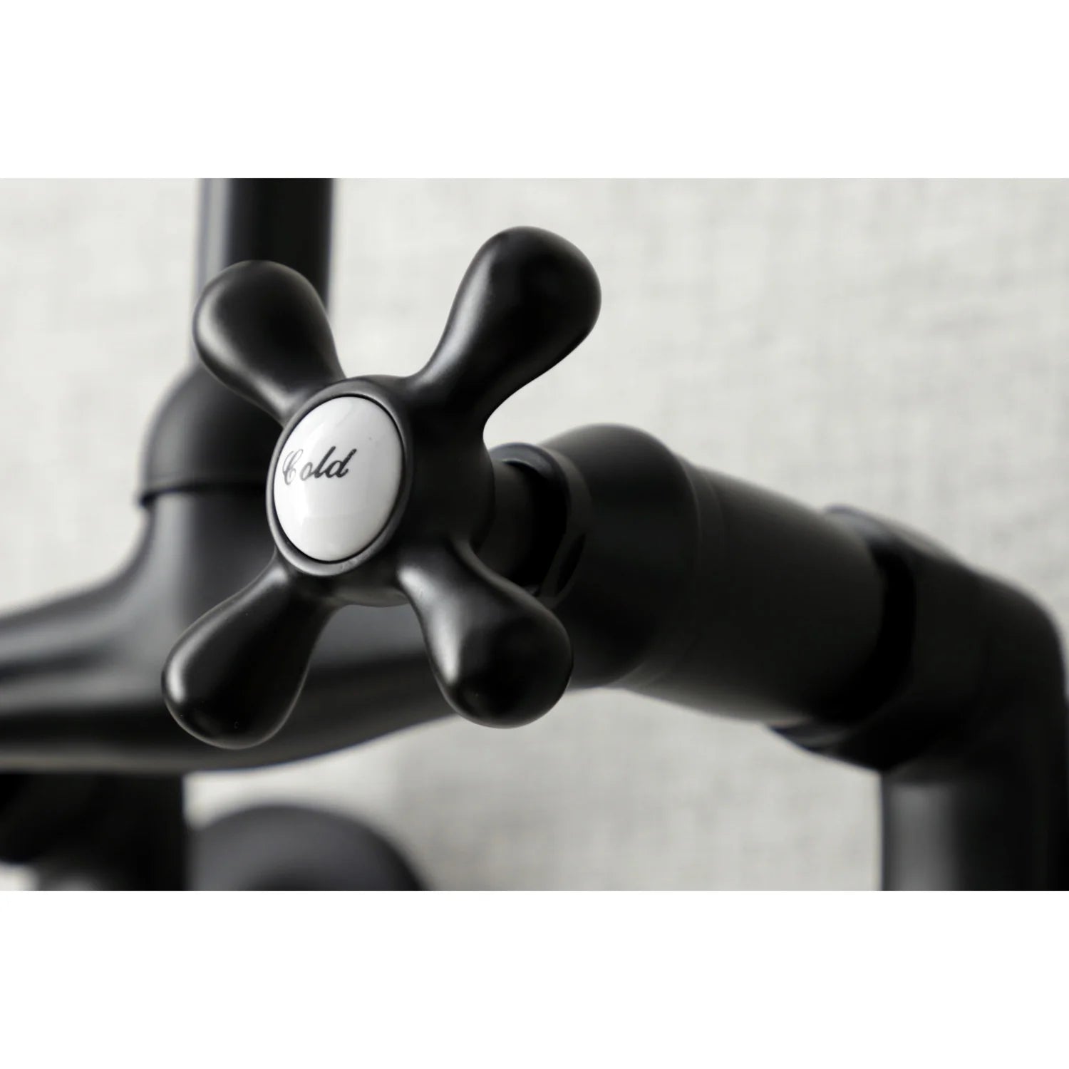 Matte black faucet cross handle with round knob center
