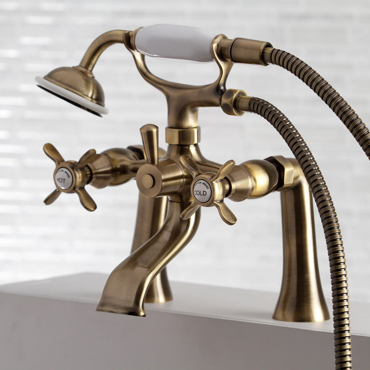 Essex 7" Center Deck-Mount Clawfoot Tub Faucet with Hand Shower in Antique Brass