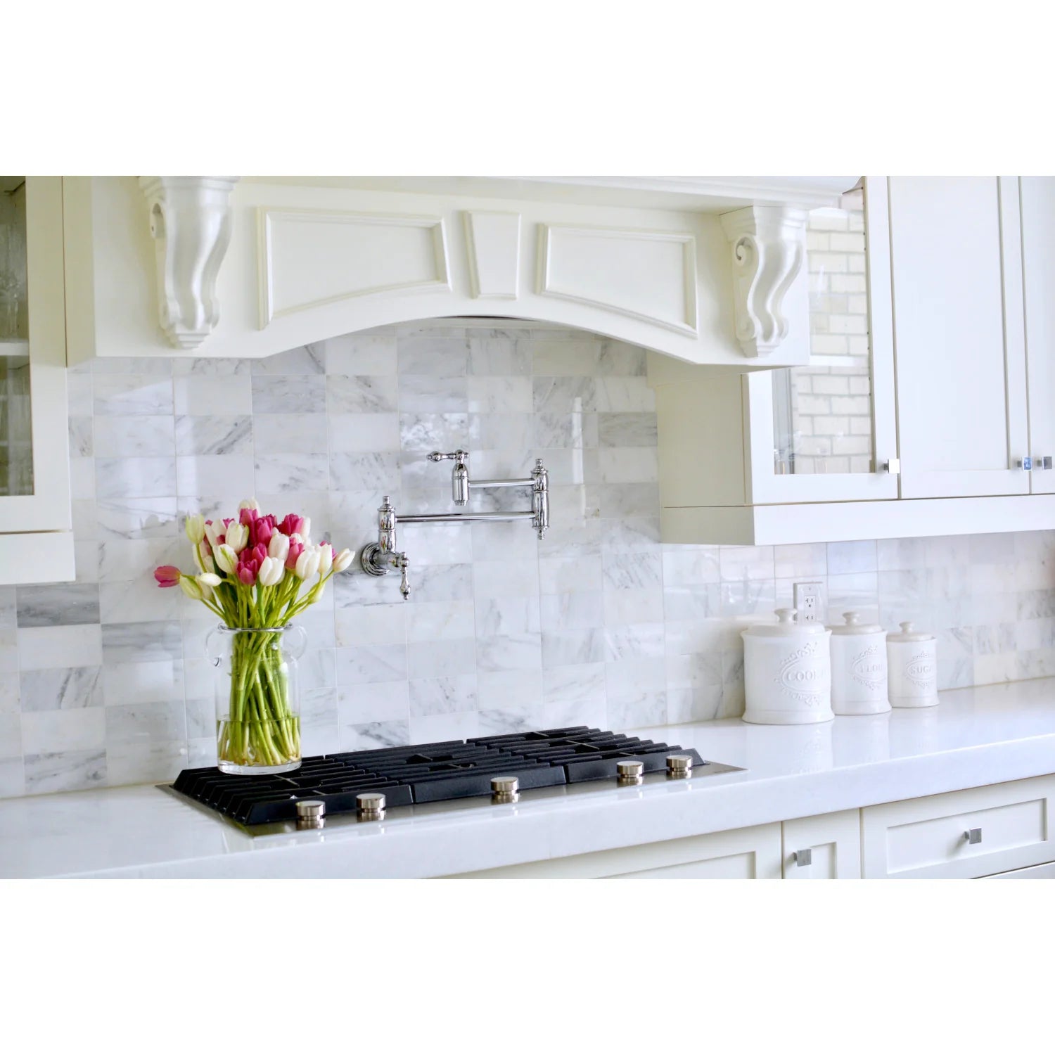 Polished chrome pot filler faucet with wall mounts and curved discharge spout