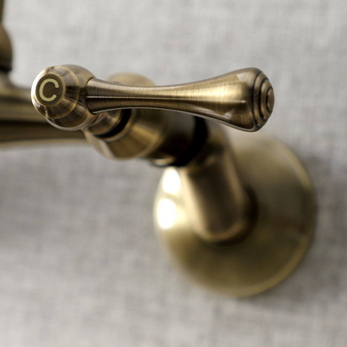 Kingston Double-Handle Wall-Mount Bridge Kitchen Faucet in Antique Brass