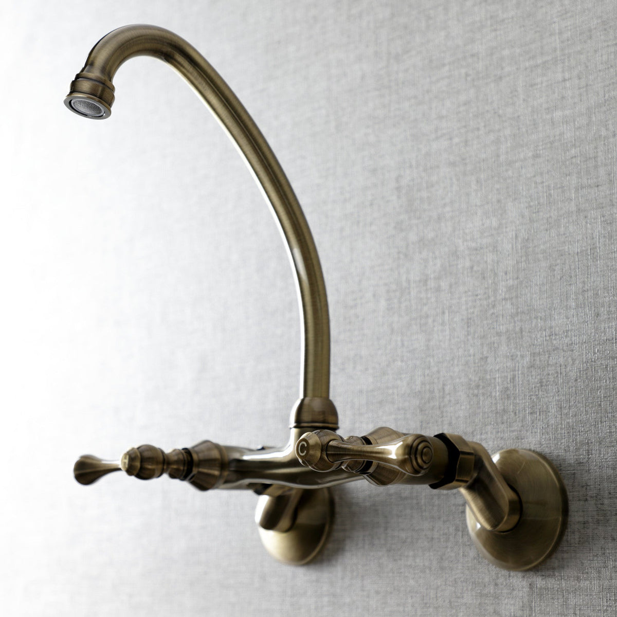 Kingston Double-Handle Wall-Mount Bridge Kitchen Faucet in Antique Brass