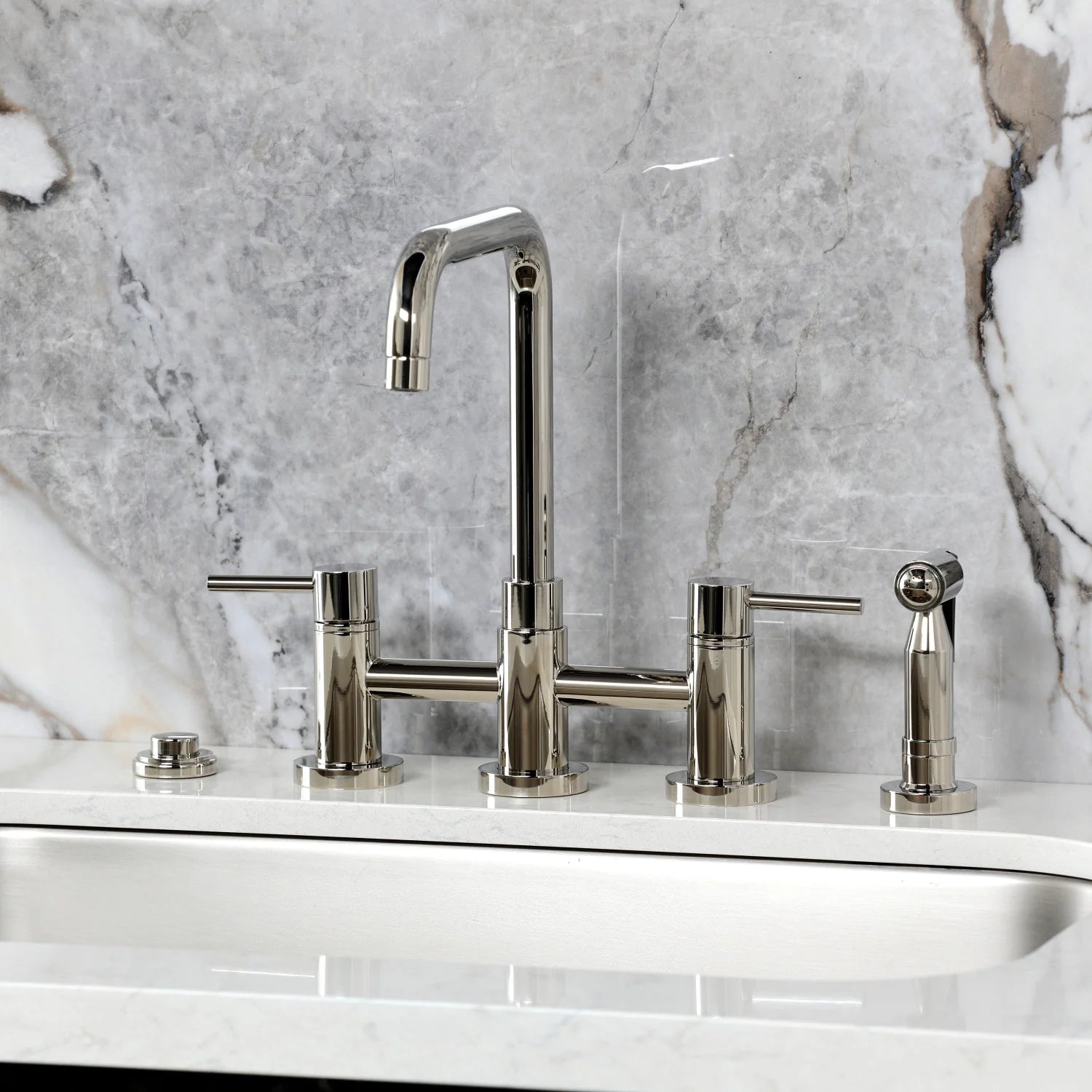 Polished nickel widespread faucet with curved spout, sprayer handle, and side controls
