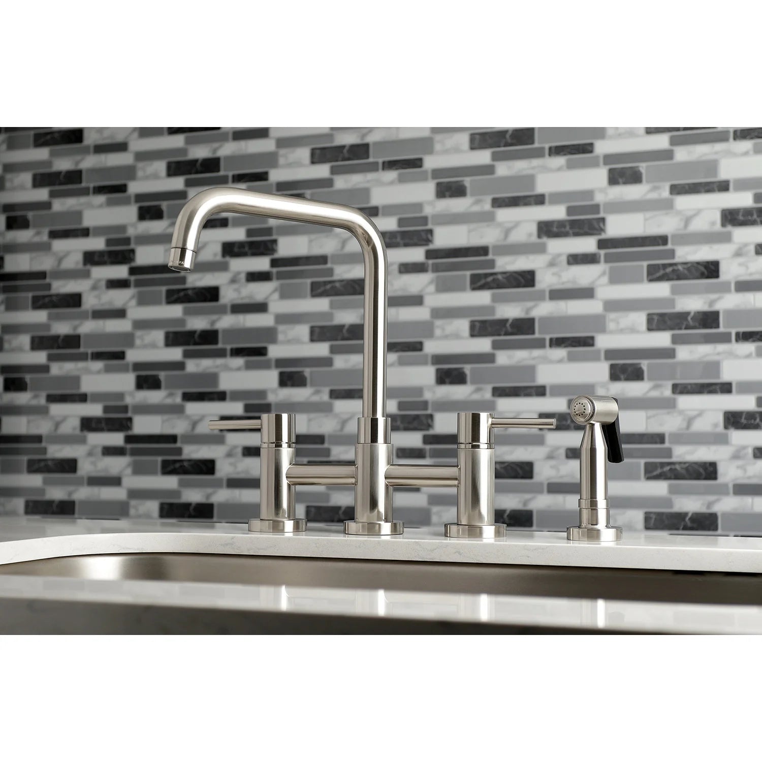 Brushed nickel bridge kitchen faucet with arched spout and side sprayer